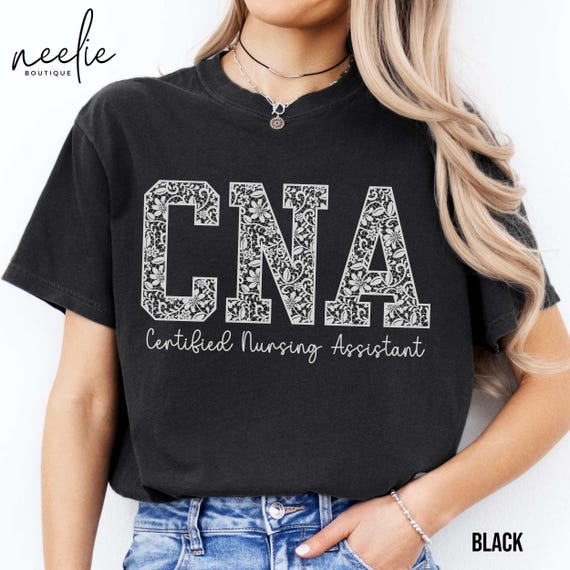 CNA Comfort Colors® Shirt, White Lace Letters Certified Nursing Assistant Trendy Varsity Collegiate Letters Lace Design T-Shirt