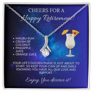 May include: A silver necklace with a clear crystal pendant in a blue and white gift box. The box has a message that says "Cheers for a Happy Retirement!" and includes a list of ingredients for a cocktail.