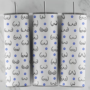 May include: Three white tumblers with a black and blue pattern. The pattern features a repeated design of a stylized breast shape with a blue evil eye in the center.