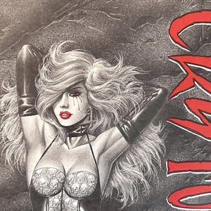 May include: A black and white illustration of a woman with long, flowing white hair. She is wearing a black corset with a skull pattern and black gloves. The word "COWBOY" is written in red letters in the background.