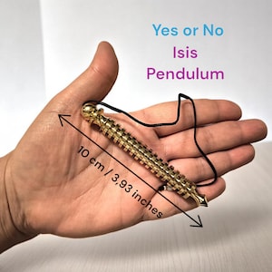 May include: A gold-colored metal pendulum with a black cord, measuring 10 cm or 3.93 inches in length. The pendulum is labeled "Yes or No Isis Pendulum".