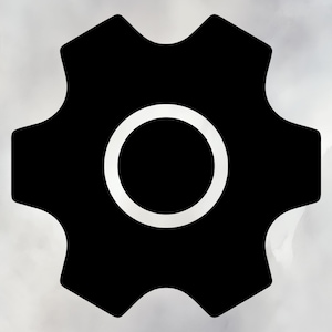 May include: A black gear icon with a white circle in the center. The gear has a cogwheel design with rounded edges. The background is a light gray, creating a simple, modern graphic.