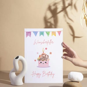 May include: A white card with a pink cupcake with a lit candle and the number 50 on top. The cupcake is filled with money. The card says "Wunscherfüller" and "Happy Birthday".