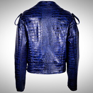 May include: A blue faux leather jacket with a crocodile print.