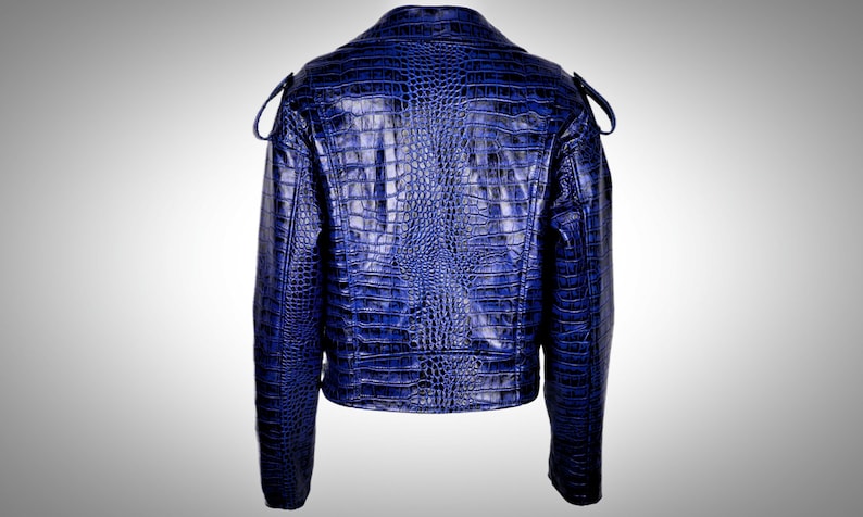 May include: A blue faux leather jacket with a crocodile print.