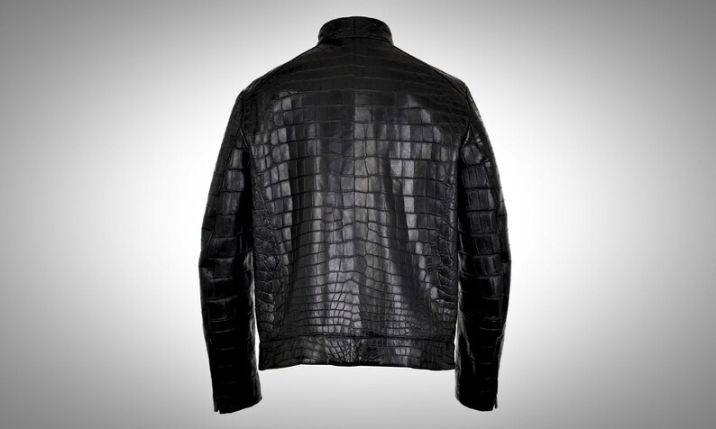 May include: A black leather jacket made from crocodile skin.