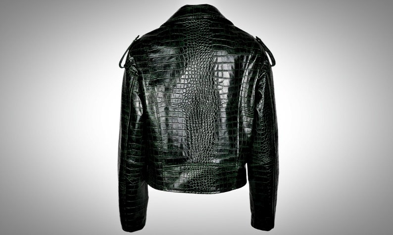 May include: A dark green leather jacket with a crocodile-embossed pattern. The jacket has a zipper closure and a stand-up collar.