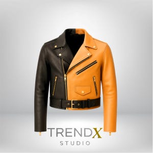 Op de afbeelding: Een tweekleurige leren jas, zwart aan de linkerkant en bruin aan de rechterkant, in klassieke bikerstijl. Voorzien van een reverskraag, asymmetrische rits en een ceintuur in de taille. Goudkleurige hardware accentueert het ontwerp. De tekst "TRENDX STUDIO" staat onderaan.