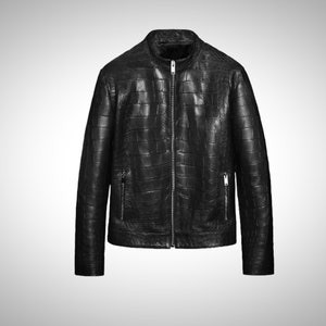 May include: A black leather jacket with a zipper closure and a crocodile-embossed pattern.