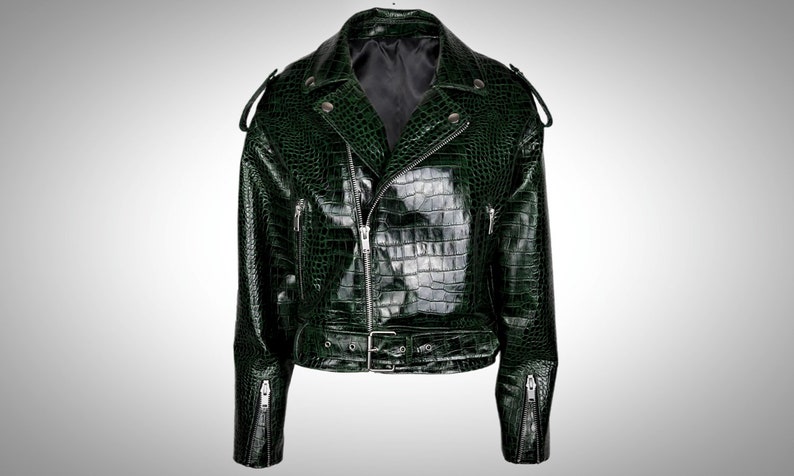 May include: A dark green faux crocodile leather motorcycle jacket with a zipper closure, a belt at the waist, and zippered pockets on the sleeves.