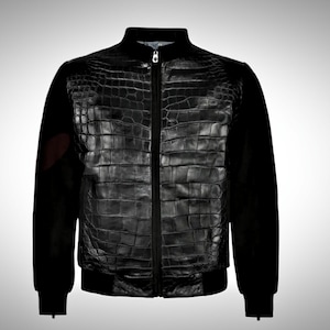 May include: A black bomber jacket with a crocodile skin pattern on the front and black sleeves.