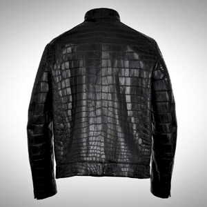 May include: A black leather jacket with a crocodile skin pattern.
