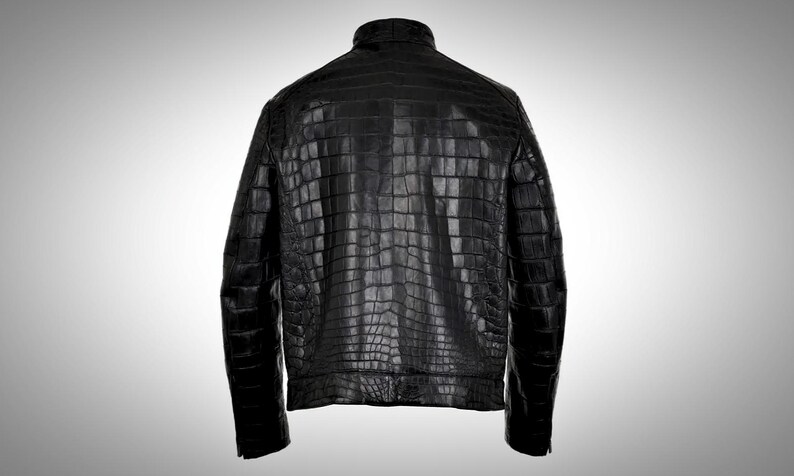 May include: A black leather jacket with a crocodile skin pattern.