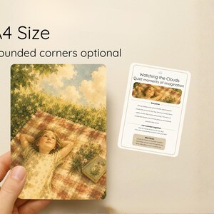 May include: A4 print with optional rounded corners, showing a vintage illustration of a child on a picnic blanket, gazing at the sky. A card with the text "Watching the Clouds" is also present.