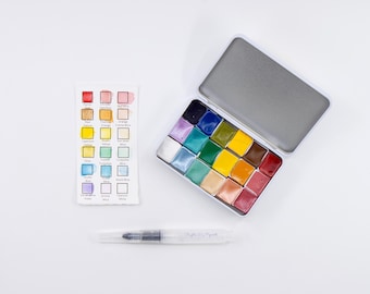 ビーチを描くための手作り水彩パレット、18枚の職人グレードのハーフパンが旅行用缶に入っています。水を入れられるブラシペンと見本チャート付き。