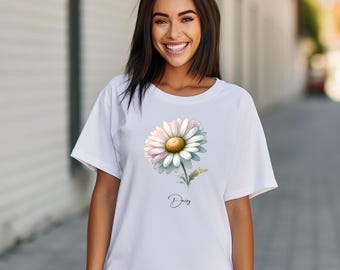 Op de afbeelding: Wit T-shirt met een aquarel margriet afbeelding en het woord "Daisy" in cursief.
