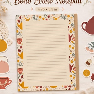 May include: A Boho Brew Notepad with cream-coloured lined paper, measuring 10.8 x 14 cm. The notepad features a floral border and tea-themed stickers, including teapots and teacups. The text "Boho Brew Notepad" is at the top.
