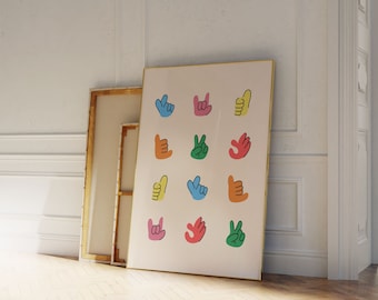 May include: A white framed poster featuring a colourful design of various hand gestures. The hand gestures include a peace sign, a thumbs up, a rock and roll sign, and a wave. The poster is hanging on a white wall.