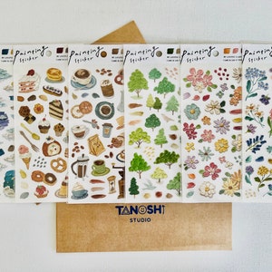 May include: Six sheets of colorful illustrated stickers with the words "Painting Sticker" on each sheet. The stickers feature various designs including clouds, stars, desserts, coffee, trees, flowers, and leaves.