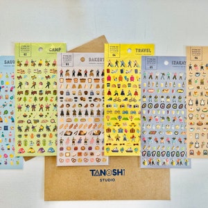 May include: Six sheets of colorful stickers with illustrations of various activities and objects. The stickers are labeled with Japanese text and the words "SAUN", "CAMP", "BAKERY", "TRAVEL", "IZAKAY", and "KISSA".