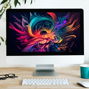 May include: A modern workspace with a desktop computer displaying an abstract colorful design, a keyboard, a mouse, a mug, and a stack of books on a wooden desk.