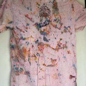 May include: A set of three ceramic mugs with a speckled, matte finish. The mugs are in shades of cream, light gray, and dark gray. Each mug has a simple, minimalist design, perfect for coffee or tea.