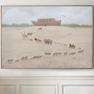 May include: A framed painting depicts a wooden ark on a hill, with pairs of animals walking towards it. The animals include giraffes, lions, elephants, zebras, and kangaroos. The artwork has a neutral color palette with a light brown frame.