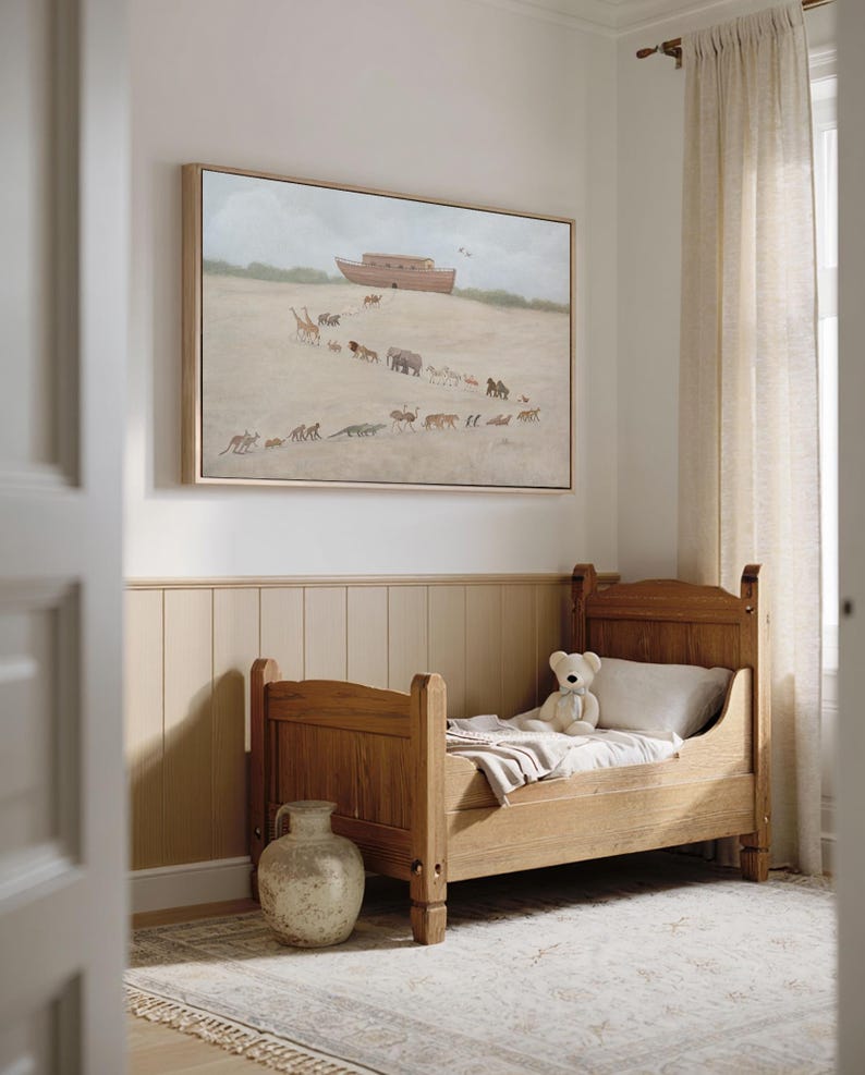 May include: A child's bedroom featuring a wooden bed with a teddy bear and a framed painting depicting animals walking towards a large ark. The room has a neutral color palette with beige walls and a patterned rug.
