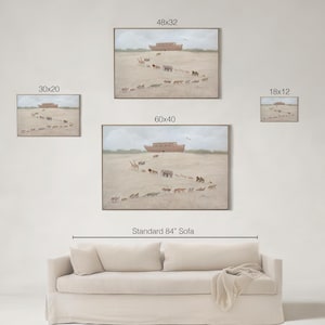 May include: Artwork featuring a framed painting of animals walking towards a wooden ark. The painting is set against a beige background. The image includes four framed paintings of different sizes, and a beige sofa.