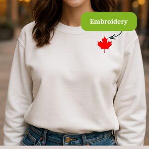 Sudadera unisex con cuello redondo y hoja de arce bordada de Canadá