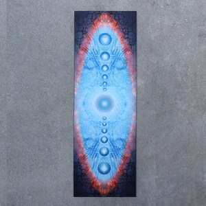 May include: A blue and orange yoga mat with a mandala design featuring a series of circles and a central eye.