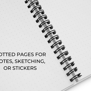 May include: A white notebook with a black spiral binding. The notebook has dotted pages and the text "DOTTED PAGES FOR NOTES, SKETCHING, OR STICKERS" printed on the front cover.