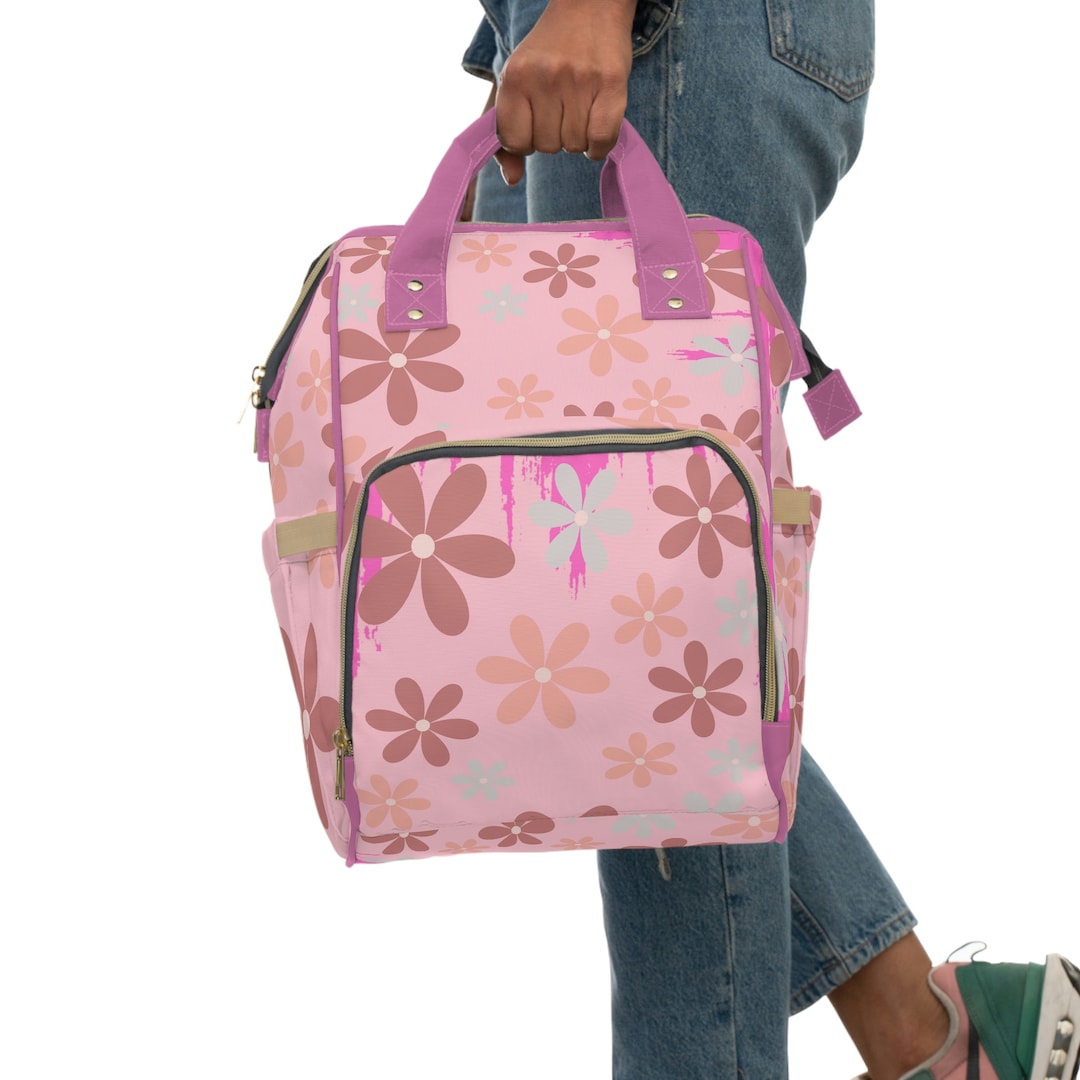 Large fuchsia and pink diaper nursing backpack bag.
