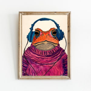 May include: A framed illustration of a toad wearing blue headphones and a pink and purple sweater.