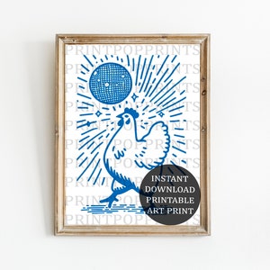 May include: A blue and white illustration of a rooster with a sunburst behind it. The rooster is holding a blue circle with stars inside. The text "INSTANT DOWNLOAD PRINTABLE ART PRINT" is in a black circle at the bottom of the image.