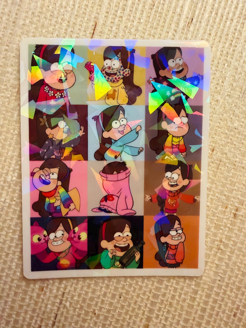 May include: A holographic sticker featuring nine different images of a cartoon character with brown hair and glasses. The character is wearing various outfits and expressions, set against a colorful grid background.
