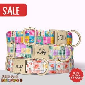 May include: Three colorful dog collars with floral and patchwork patterns. The collars have gold-colored buckles and D-rings. One collar is engraved with "Lily", another with "Stella", and the third with "Bella". The image includes the word "SALE".