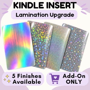 May include: Four rectangular Kindle inserts with lamination upgrades. The first has a rainbow holographic finish, the second a geometric triangle pattern, the third a fine silver shimmer, and the fourth a pattern of small colorful stars.