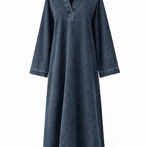 May include: A long, dark blue denim dress with a collared neckline and long sleeves. The dress has a V-neck and a relaxed fit, suitable for casual wear. The fabric appears to be a medium-weight denim.