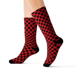 May include: A pair of red and black checkered socks. The socks are made of a soft, comfortable material and are perfect for everyday wear.
