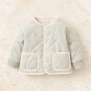May include: A light green quilted jacket with a round collar and two front pockets. The jacket has a diamond pattern and is trimmed with a light beige color. The cuffs are a knitted light grey color. The jacket has three buttons.
