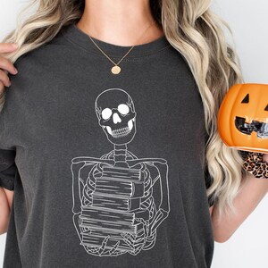 Skeleton Reader Book T-Shirt: Spooky Halloween Bookworm Tee
