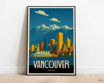 May include: A framed art print showing a stylized illustration of Vancouver, Canada. The artwork depicts a cityscape with yellow and orange buildings, snow-capped mountains, and the text "VANCOUVER CANADA". The colour palette includes blues, yellows, and oranges.