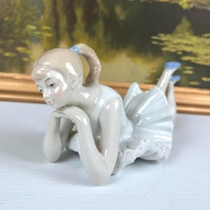 NAO by Lladro Porcelain Ballerina Figurine. Ballet Figurine laying with hands clasped