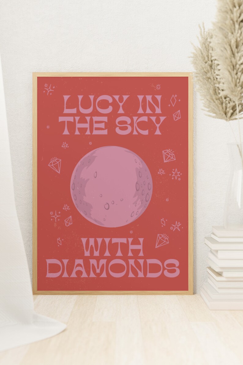 Lucy In The Sky With Diamonds Print Poster. Inspired by The Beatles famous song. Red and pink design with a moon in the middle and diamonds and stars around the writing and moon.