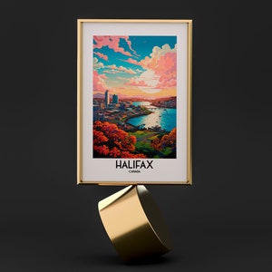 K&ouml;nnte beinhalten: Ein gerahmter Druck einer Stadtlandschaft mit einem Fluss und einem Sonnenuntergangshimmel. Der Druck ist mit "Halifax, Kanada" betitelt.