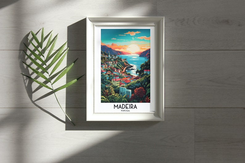 May include: A framed print of a colorful illustration of a coastal town with the text "MADEIRA PORTUGAL" at the bottom.