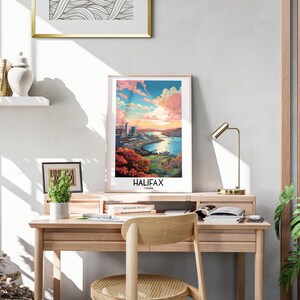 K&ouml;nnte beinhalten: Ein gerahmtes Poster mit einer farbenfrohen Illustration der Skyline von Halifax, mit einem Gew&auml;sser und einem Sonnenuntergangshimmel. Das Poster tr&auml;gt den Text "HALIFAX, Canada" am unteren Rand.