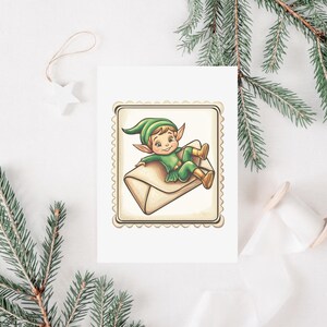 May include: A greeting card featuring a cartoon elf in a green outfit and hat, reclining on a tan envelope. The card has a decorative border and is set against a white background with pine branches and a star ornament.