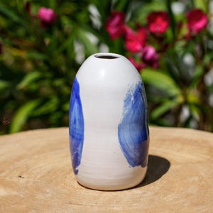 White and blue ceramic vase. Blue and white stoneware soliflore.